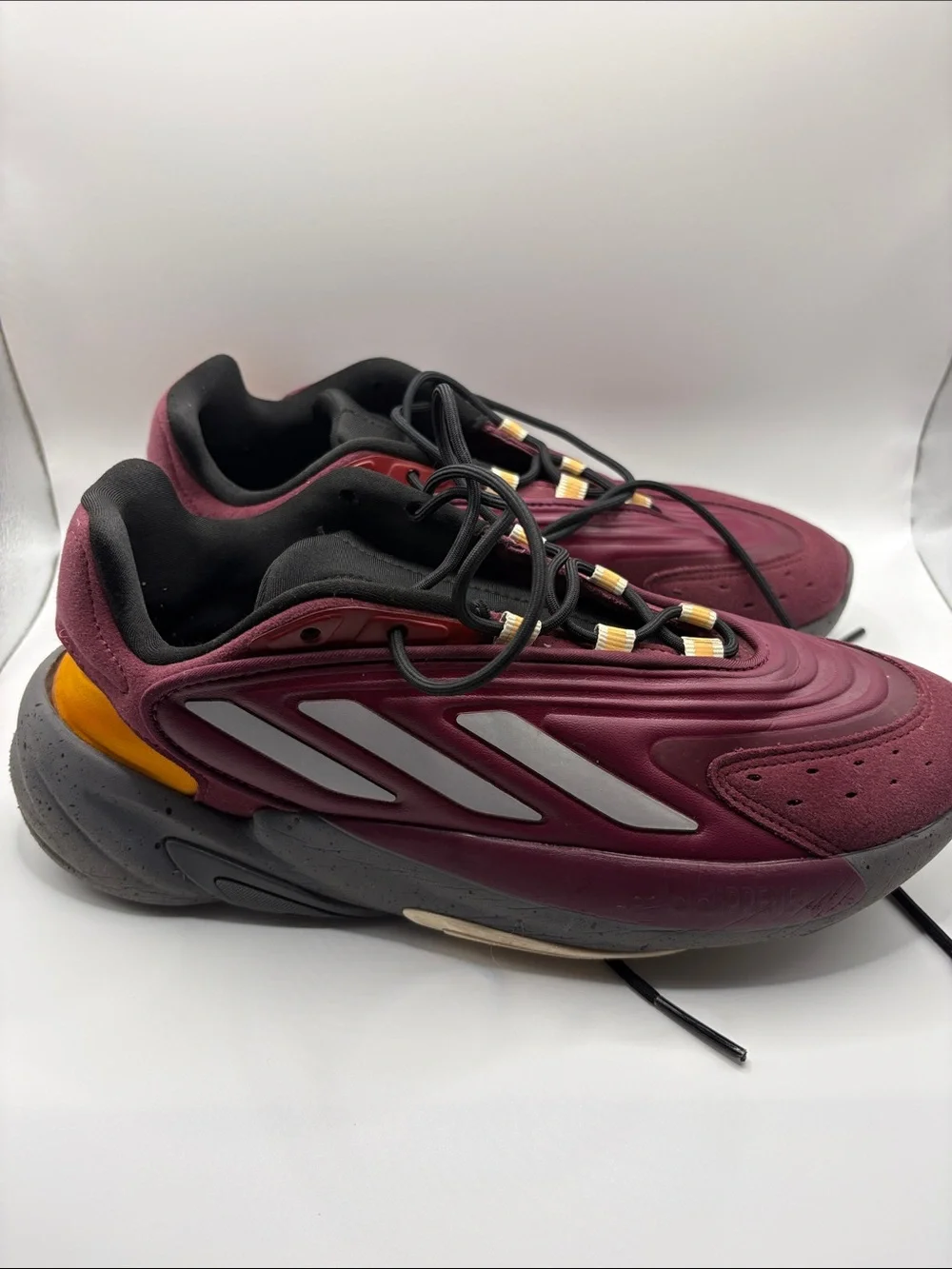 adidas OZELIA Men’s Burgundy and Black Running Sneaker with Yellow Accents